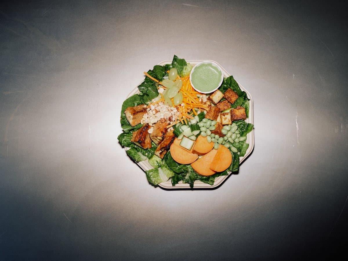 Blissful Balance plate with tofu, sweet potato, edamame, carrot, and honey nuts