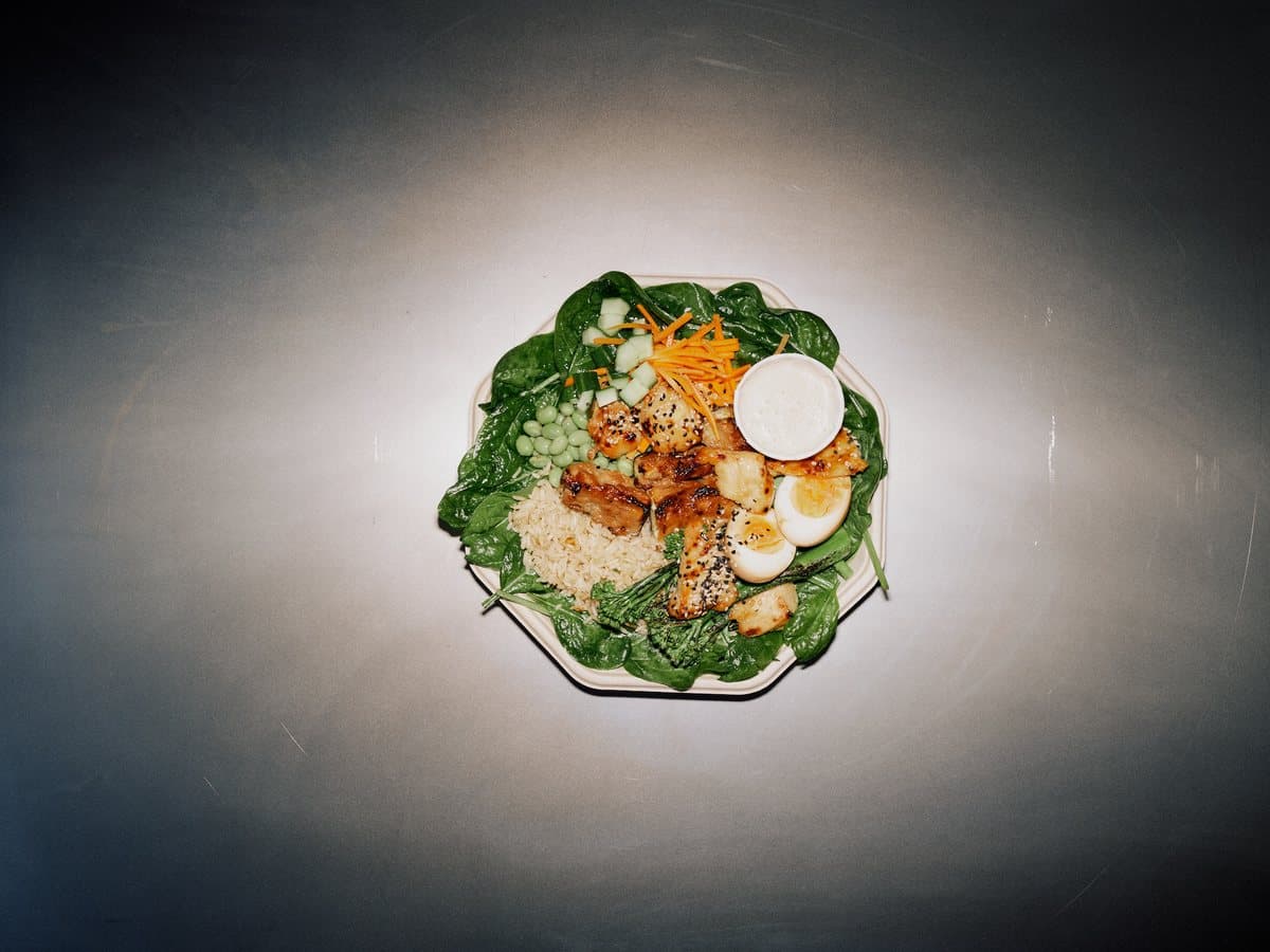 Crystal CLYR plate with ponzu chicken, ramen egg, edamame, sesame, and peanut sauce